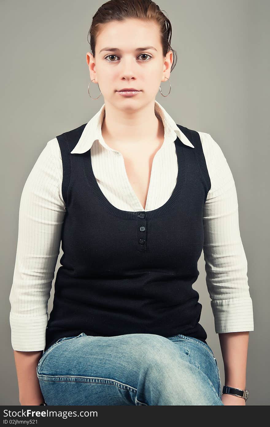 Portrait of a young woman siting down