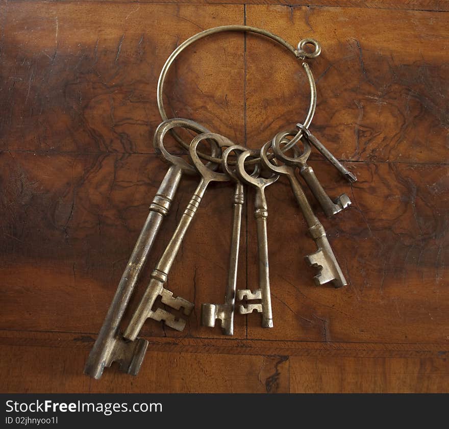 Antique skeleton keys with wood background. Antique skeleton keys with wood background.