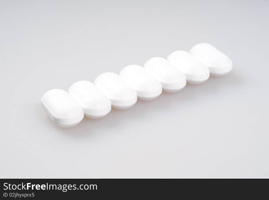 White Pills Packed In A Row