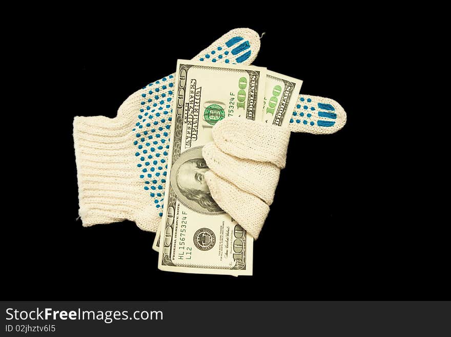 A glove with money isolated on black. A glove with money isolated on black