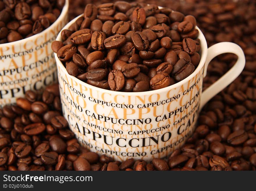 Coffee Beans In A Cappuccino Cup