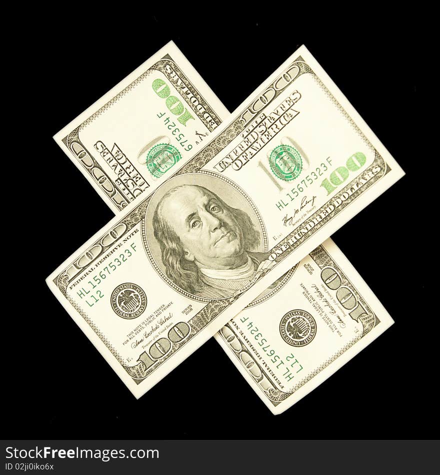 A money cross isolated on black