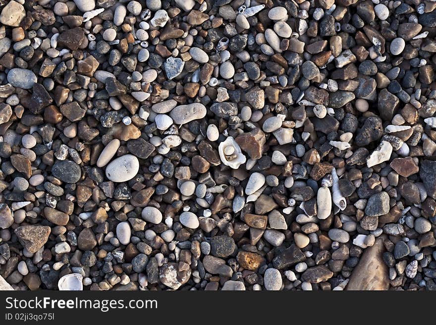 Various colored small river stones and shells