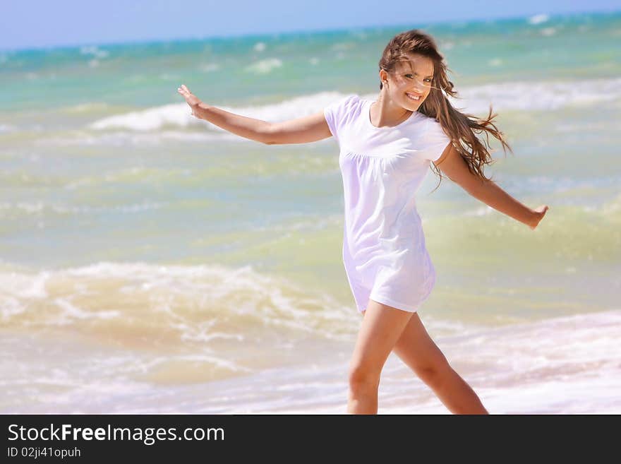 Happy girl on sea background