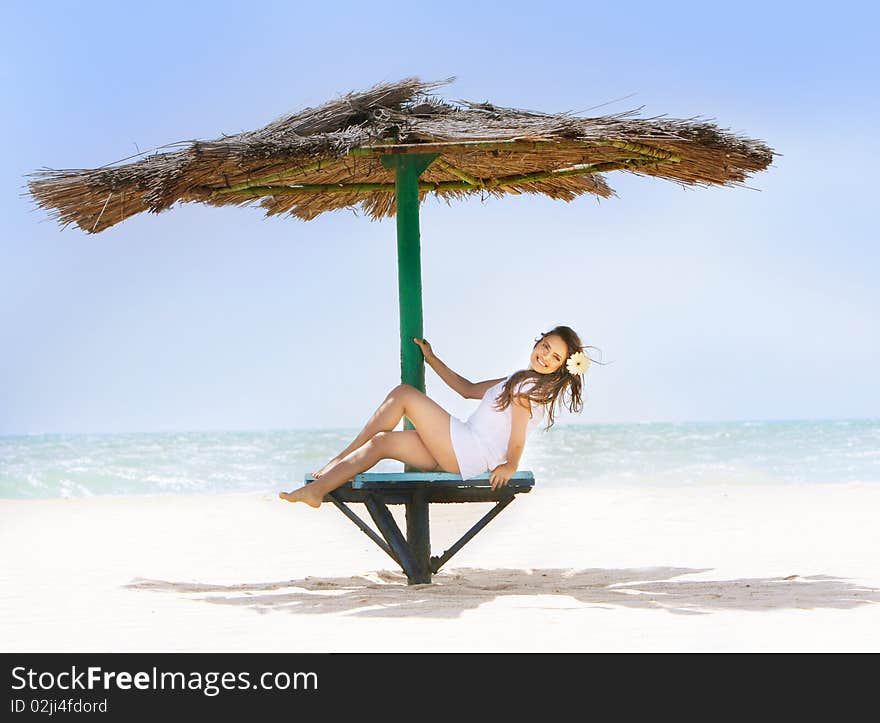 Happy girl relaxing on beach