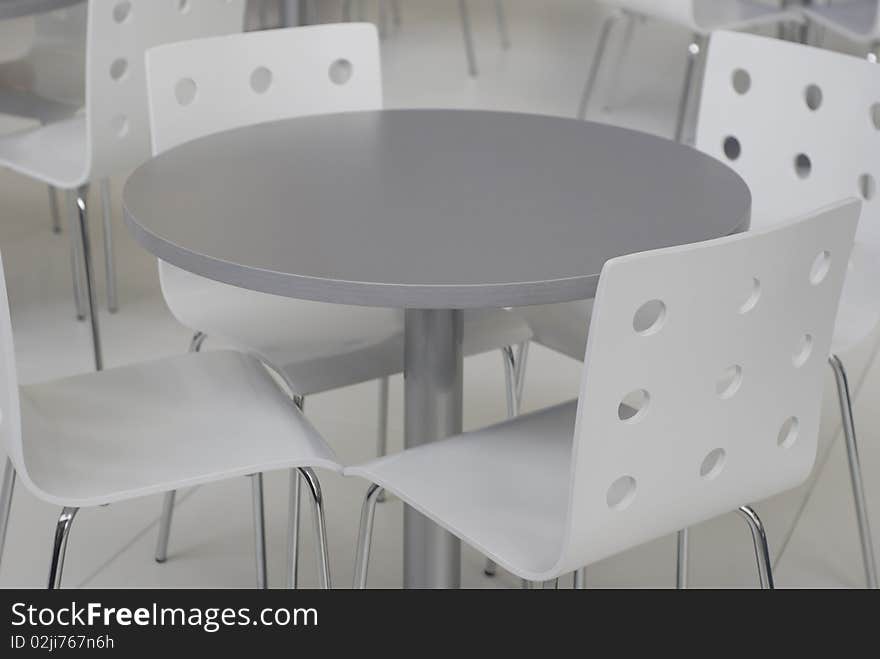 Grey chairs and table inside of office building