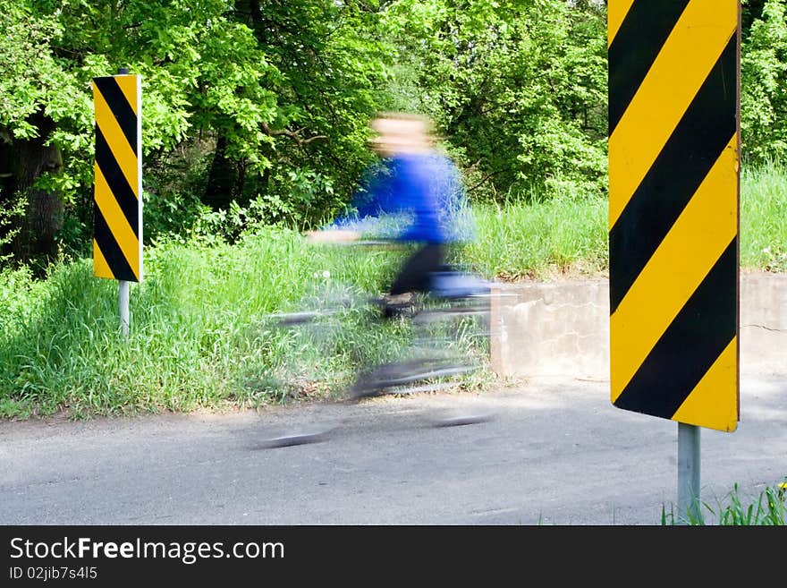 Motion blur of cyclist on country road