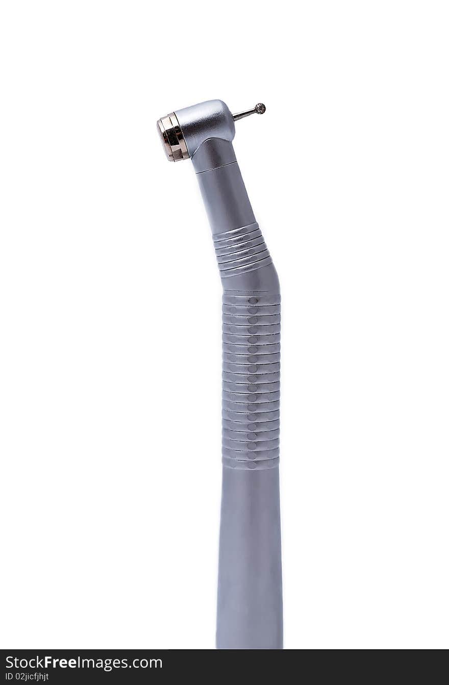 Dental handpiece in a vertical orientation on a white background. Dental handpiece in a vertical orientation on a white background