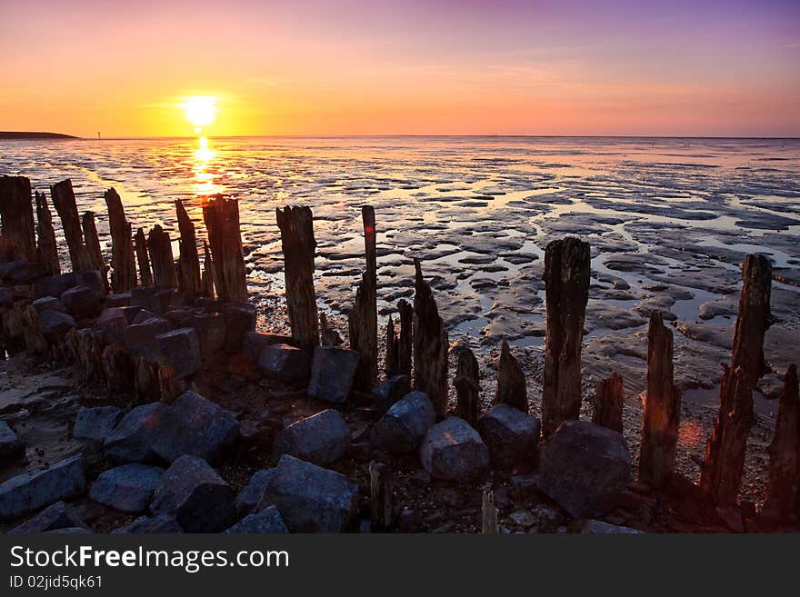 Poles in the ocean at a beautiful sunset. Poles in the ocean at a beautiful sunset