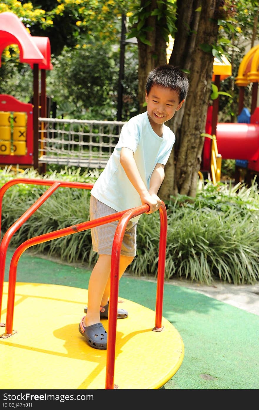 A child playing on playground. A child playing on playground.