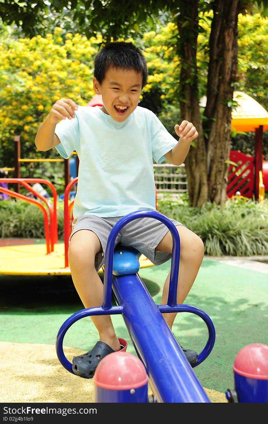 A child playing on playground. A child playing on playground.