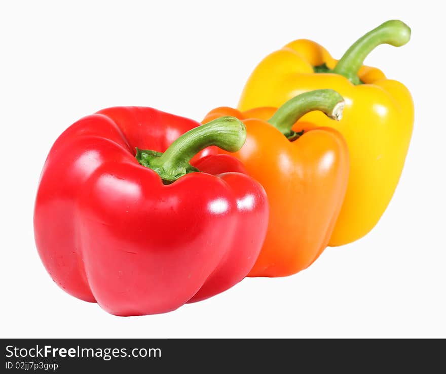 Orange, Red, and Yellow Bell Peppers, isolated on a white background. Orange, Red, and Yellow Bell Peppers, isolated on a white background