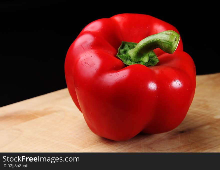 Red Bell Pepper on a cutting board