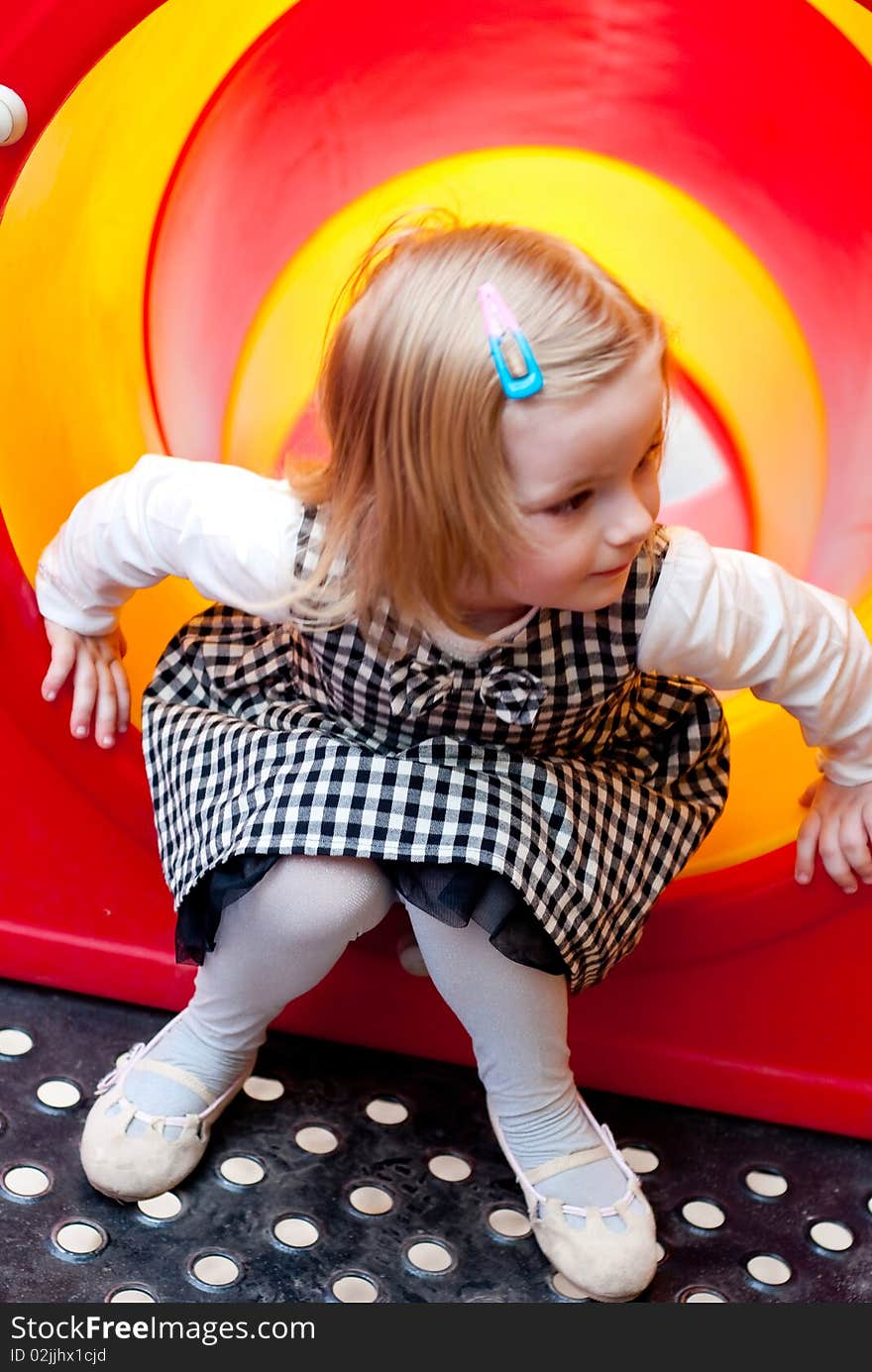 Girl in the playground . Outdoor shot. Girl in the playground . Outdoor shot