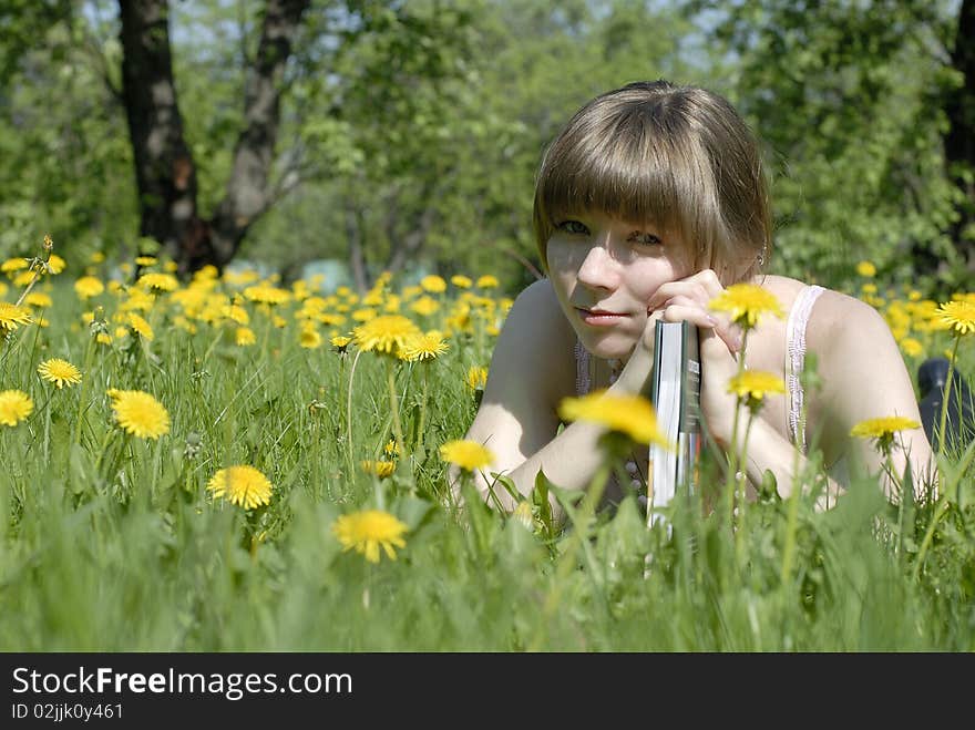 Young student with book in the park. Young student with book in the park