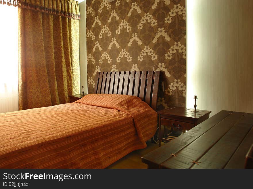 Interior of a bedroom with big bed