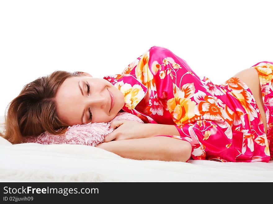 Sweet Young Girl In Pink Pajamas On Bed