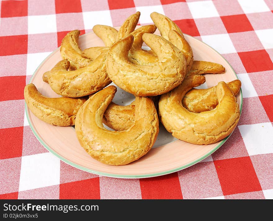 Plate with croissant on red cloth