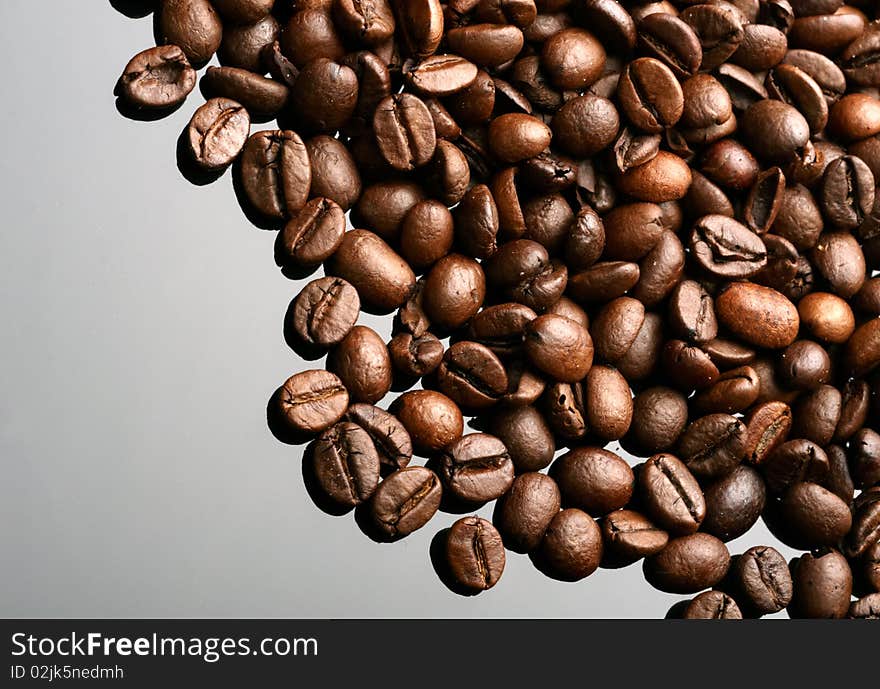 Coffee beans on mirror background. Coffee beans on mirror background