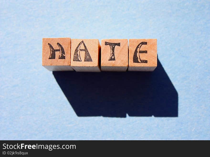 Word hate in wooden block letters