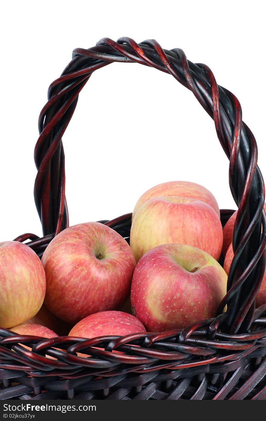 A basket of red apples on white background