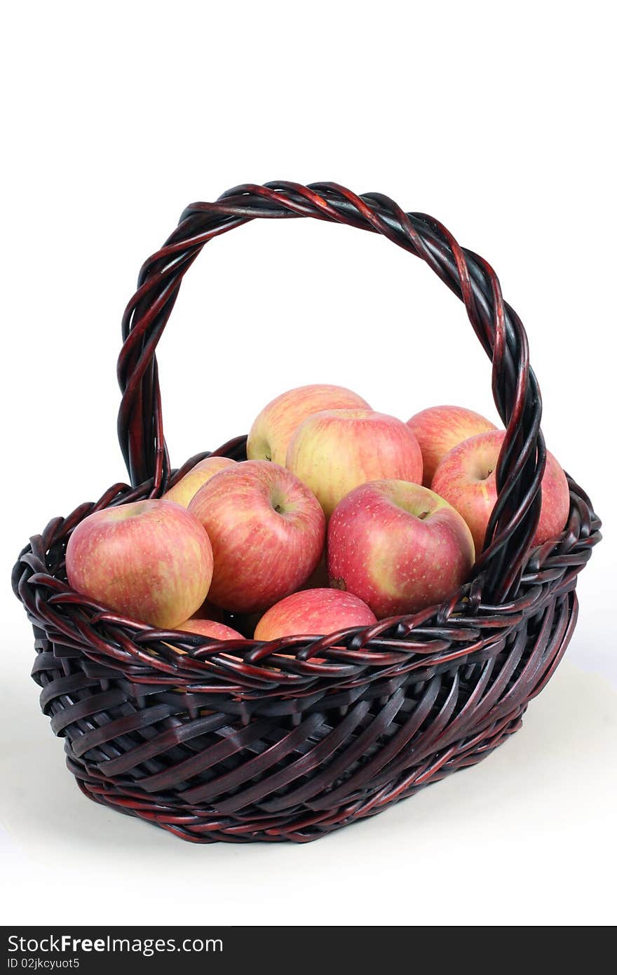 A basket with red ripe apples