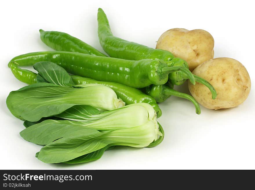 Rape, potatoes, pepper on a white background. Rape, potatoes, pepper on a white background