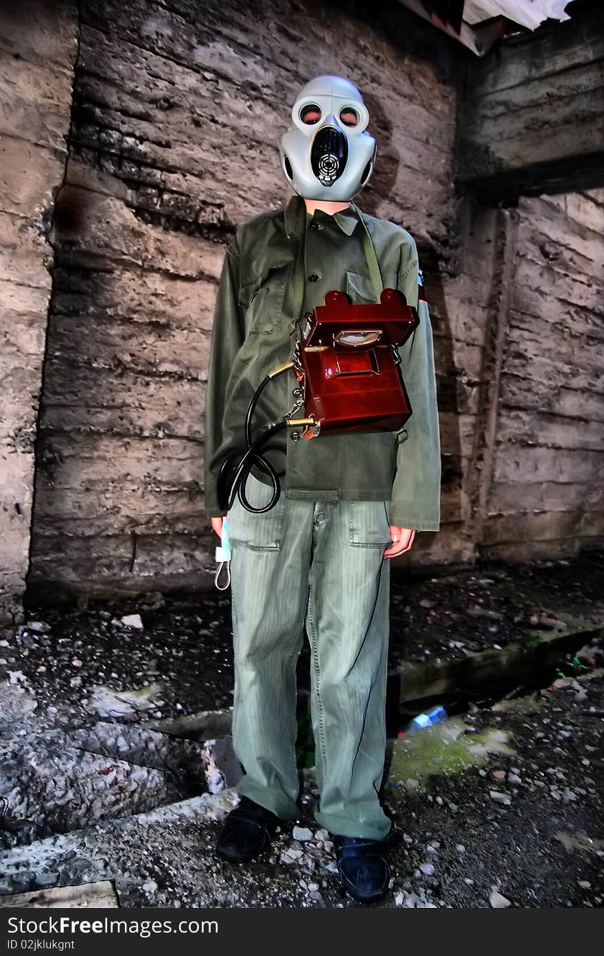 Teenager weared American military uniform.Lost city. Near Chernobyl area. Modern ruins. Ukraine. Kiev region. Teenager weared American military uniform.Lost city. Near Chernobyl area. Modern ruins. Ukraine. Kiev region