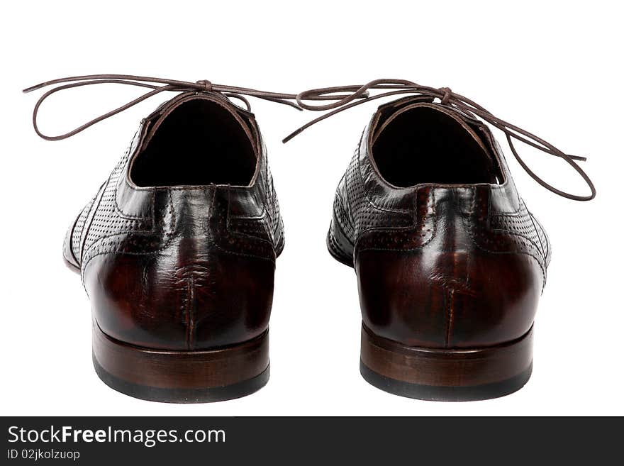 Black female shoes on a high heel. It is isolated on a white background