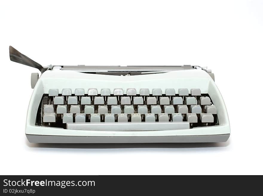 Very old typewriter seen the girl who is isolated on a white background. Very old typewriter seen the girl who is isolated on a white background