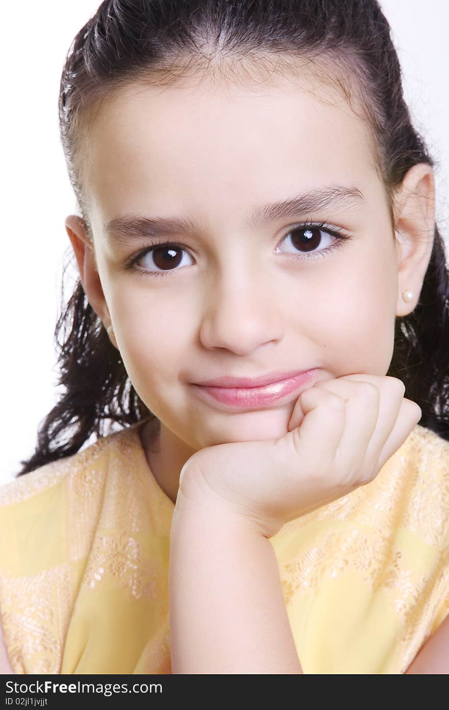 Girl looking at the camera with his hand on his face. Girl looking at the camera with his hand on his face