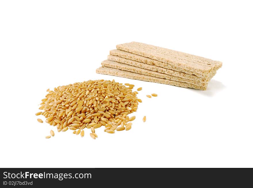 Wheat bread with grains of wheat are isolated on a white background. Wheat bread with grains of wheat are isolated on a white background