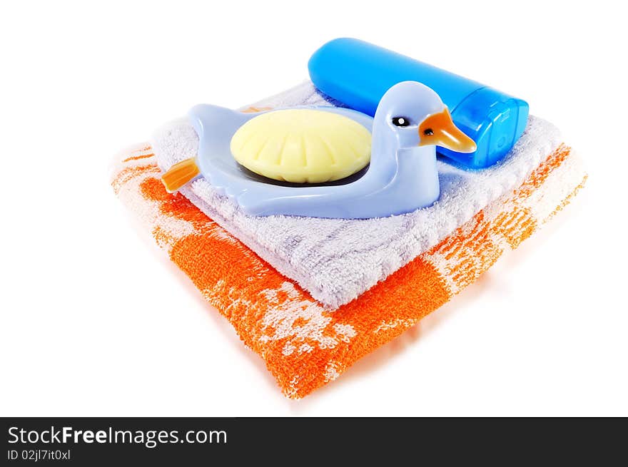 Towels, soap with soap dish isolated on a white background. Towels, soap with soap dish isolated on a white background