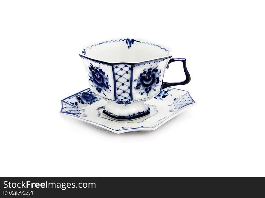 Cup and saucer by white and blue coloring, isolated