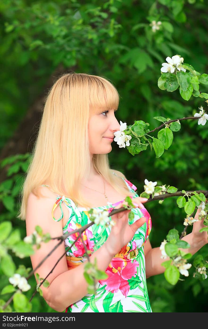 Woman sniffing flowers