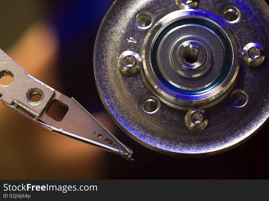 Head of hard drive disc macro view.