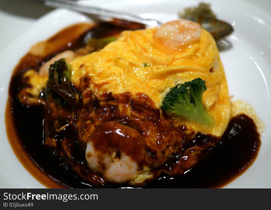 Seafood Omelet Rice with beef source