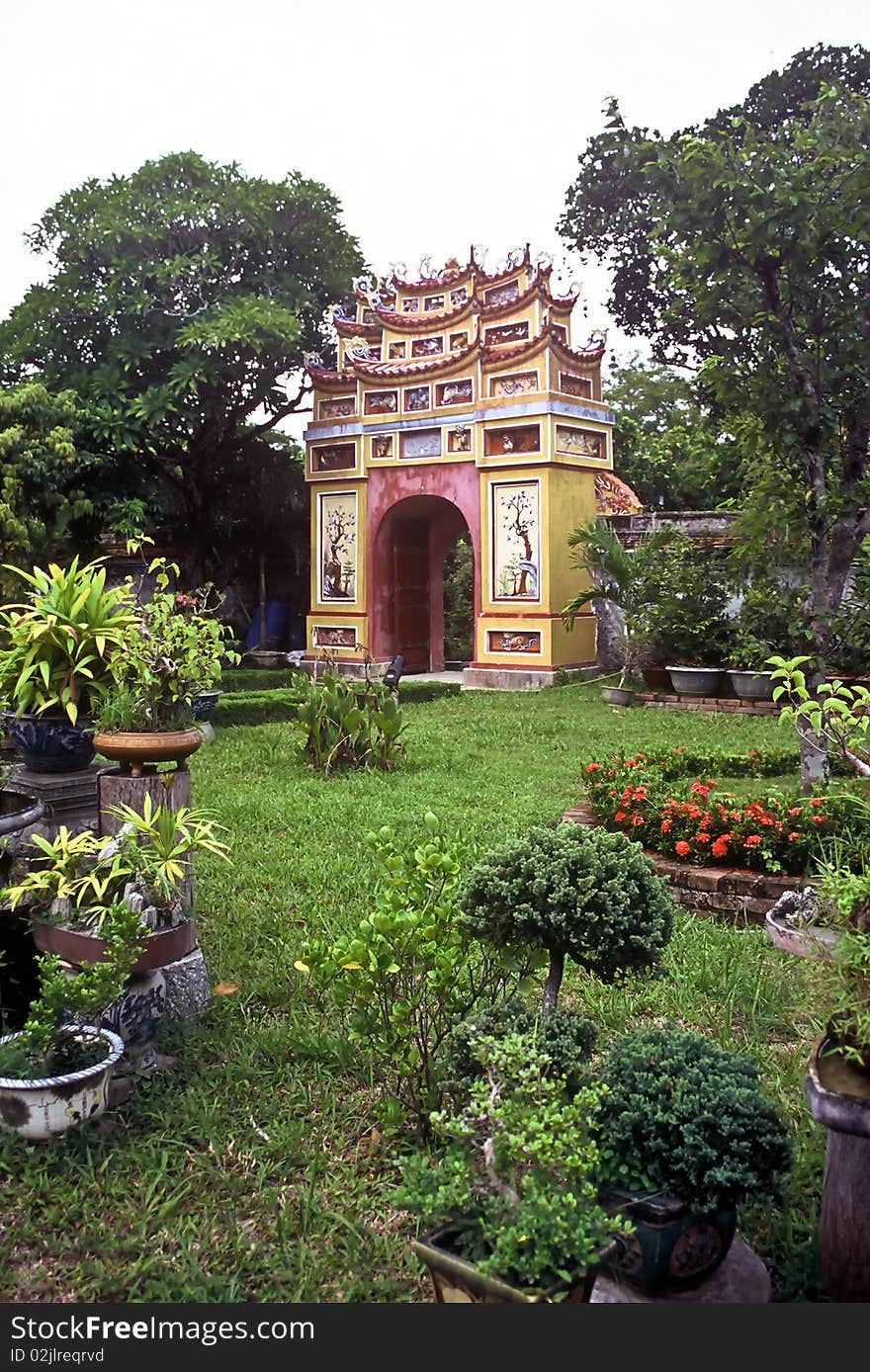 Park with a colorful gate in the city of Hue, Vietnam. Park with a colorful gate in the city of Hue, Vietnam