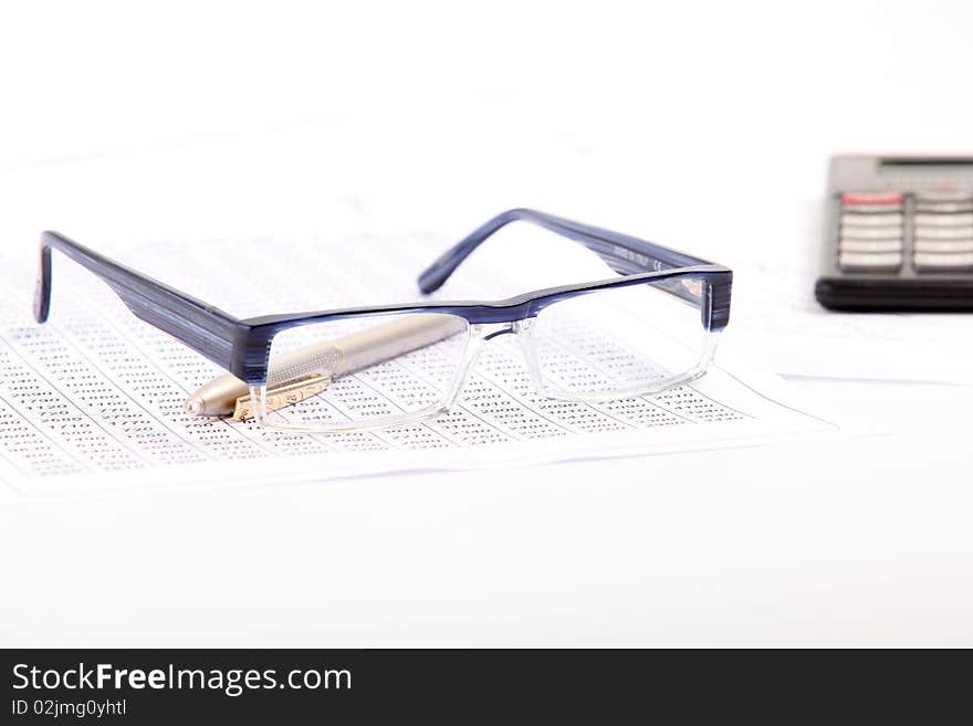 Finance document with blue glasses and gold pen. Finance document with blue glasses and gold pen