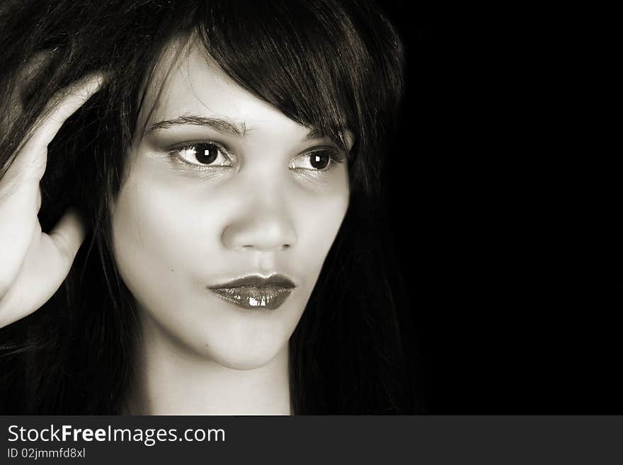 Beautiful young female model against a black background. Beautiful young female model against a black background