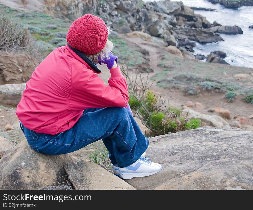 Woman Looking Out To Sea