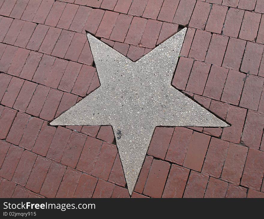 A Concrete Star In The Sidewalk