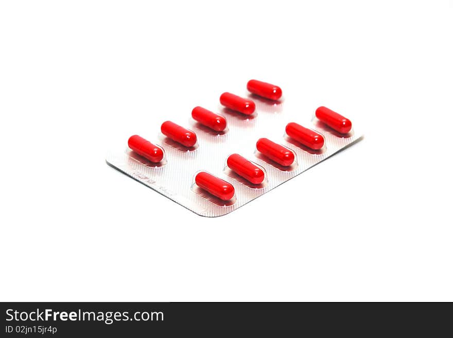 Photo of the packing of pills on white background