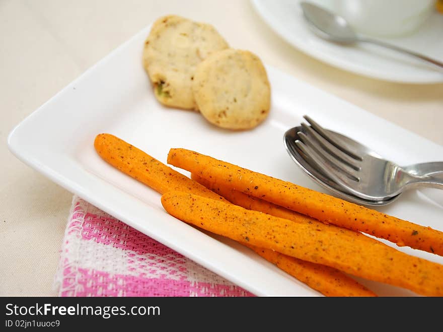 Healthy cookies filled with nuts and tomato sticks for a healthy and nutritious afternoon snack. Concepts such as food and beverage, diet and nutrition, and healthy lifestyle. Healthy cookies filled with nuts and tomato sticks for a healthy and nutritious afternoon snack. Concepts such as food and beverage, diet and nutrition, and healthy lifestyle.