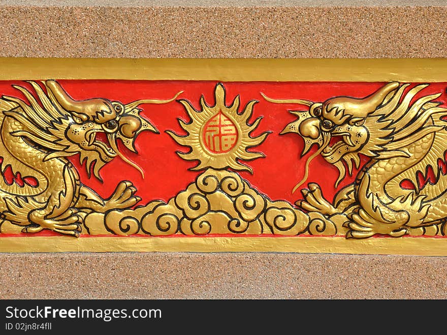 Golden dragon pattern carve on wall,thailand.