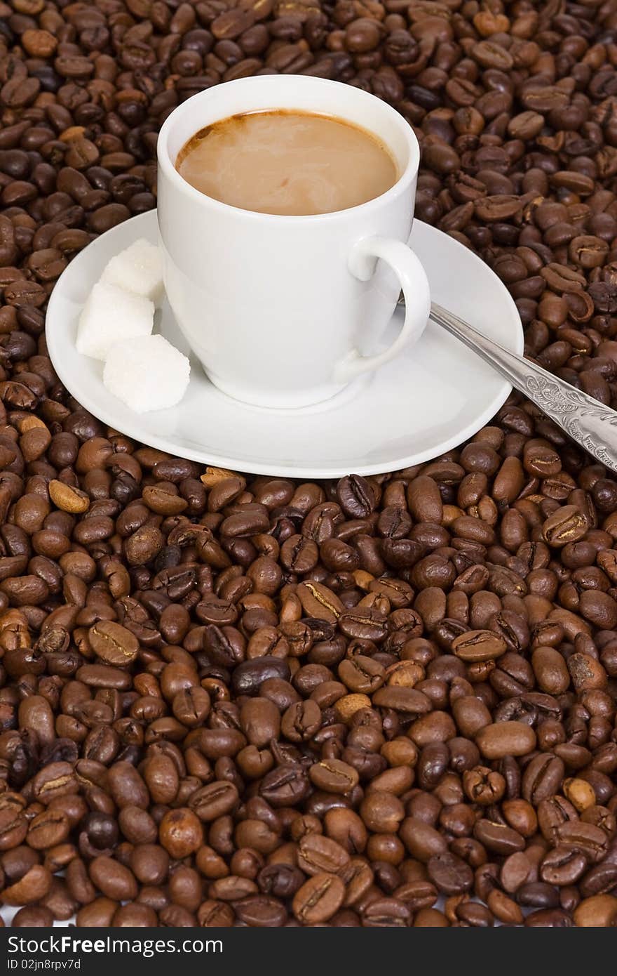 Sugar, spoon and coffee beans