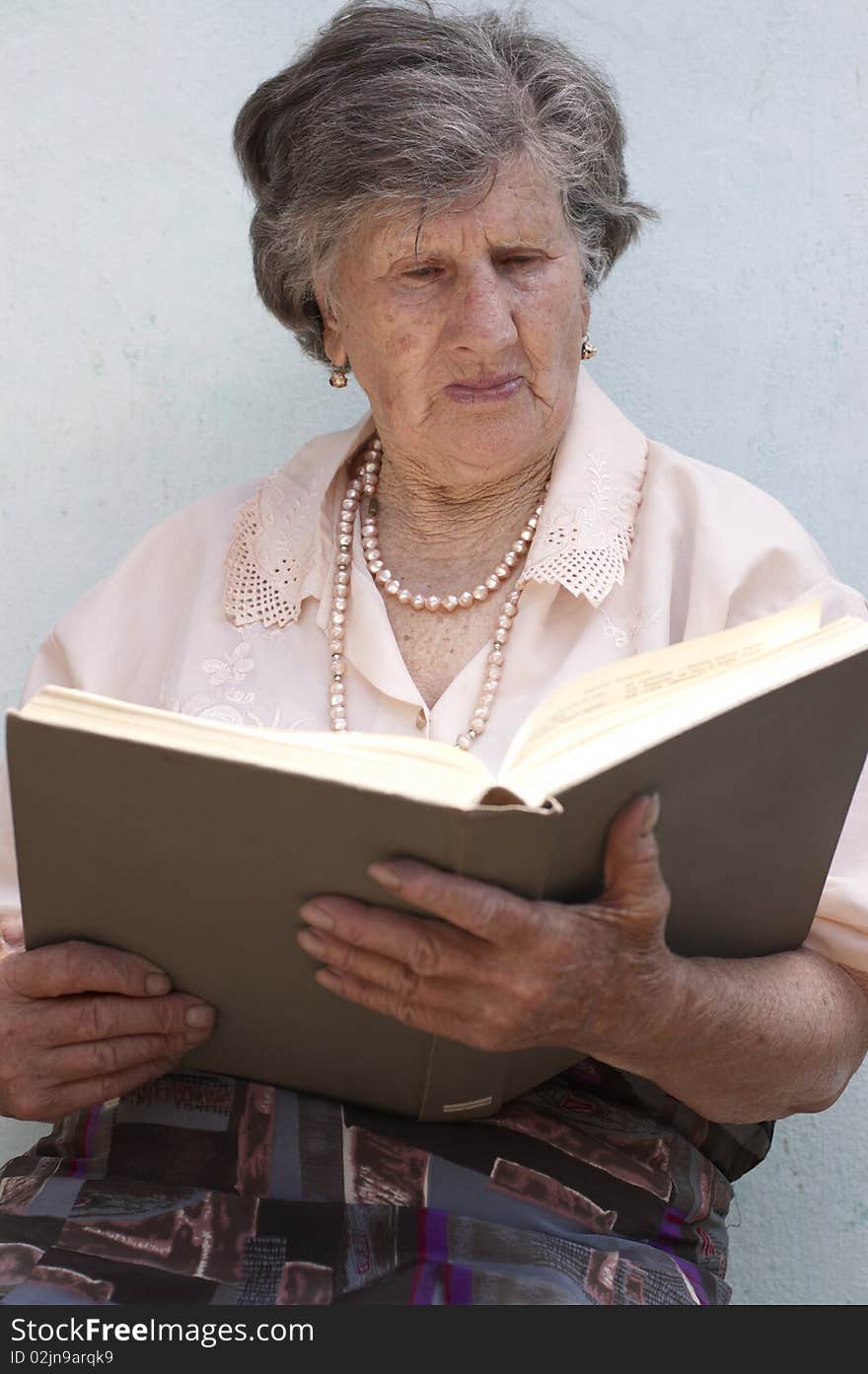 Old woman (85 years) reading book. Old woman (85 years) reading book