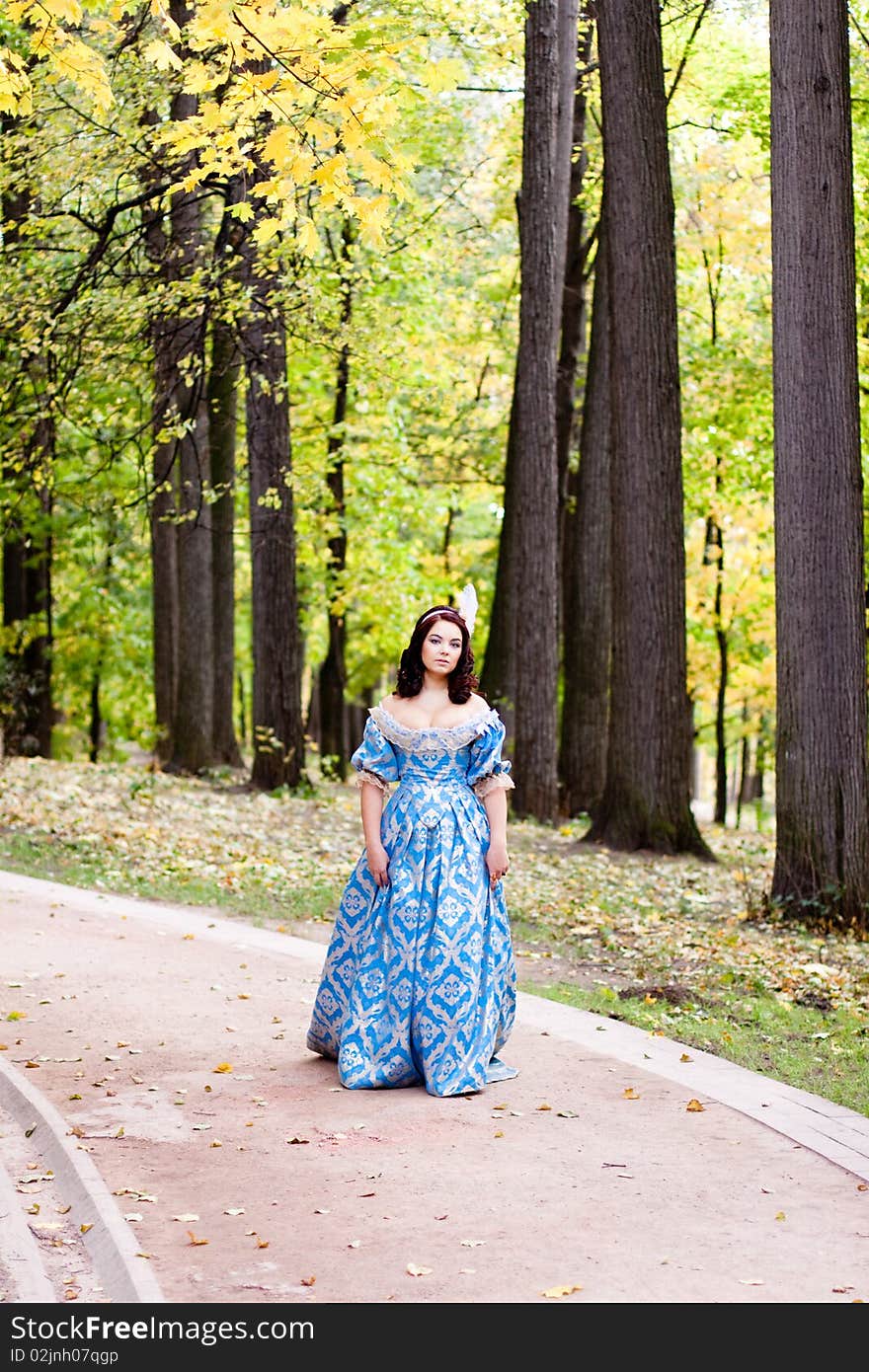 A portrait of lady in blue baroque dress