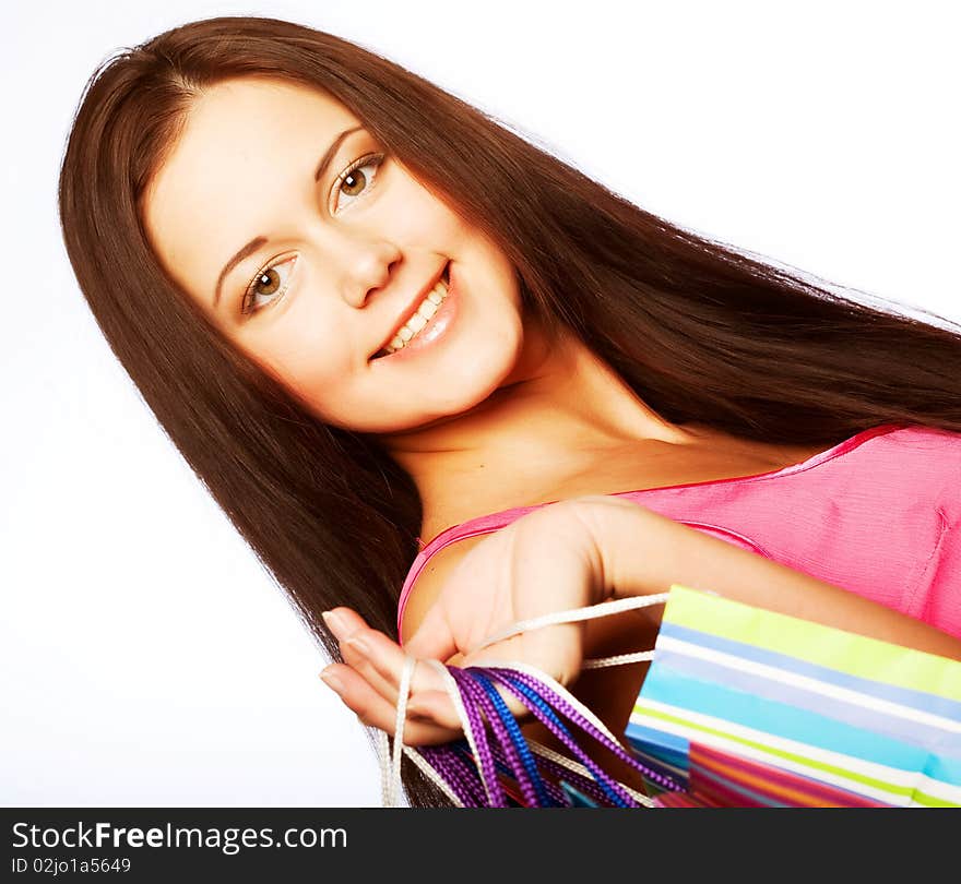 Shopping woman smiling. Isolated over white background