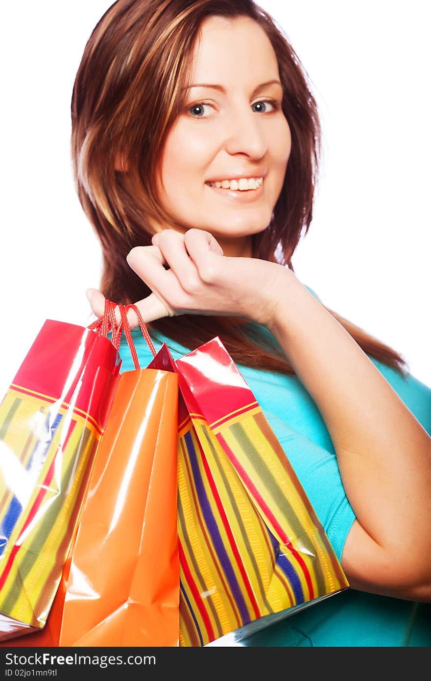 Shopping woman smiling. Isolated over white background